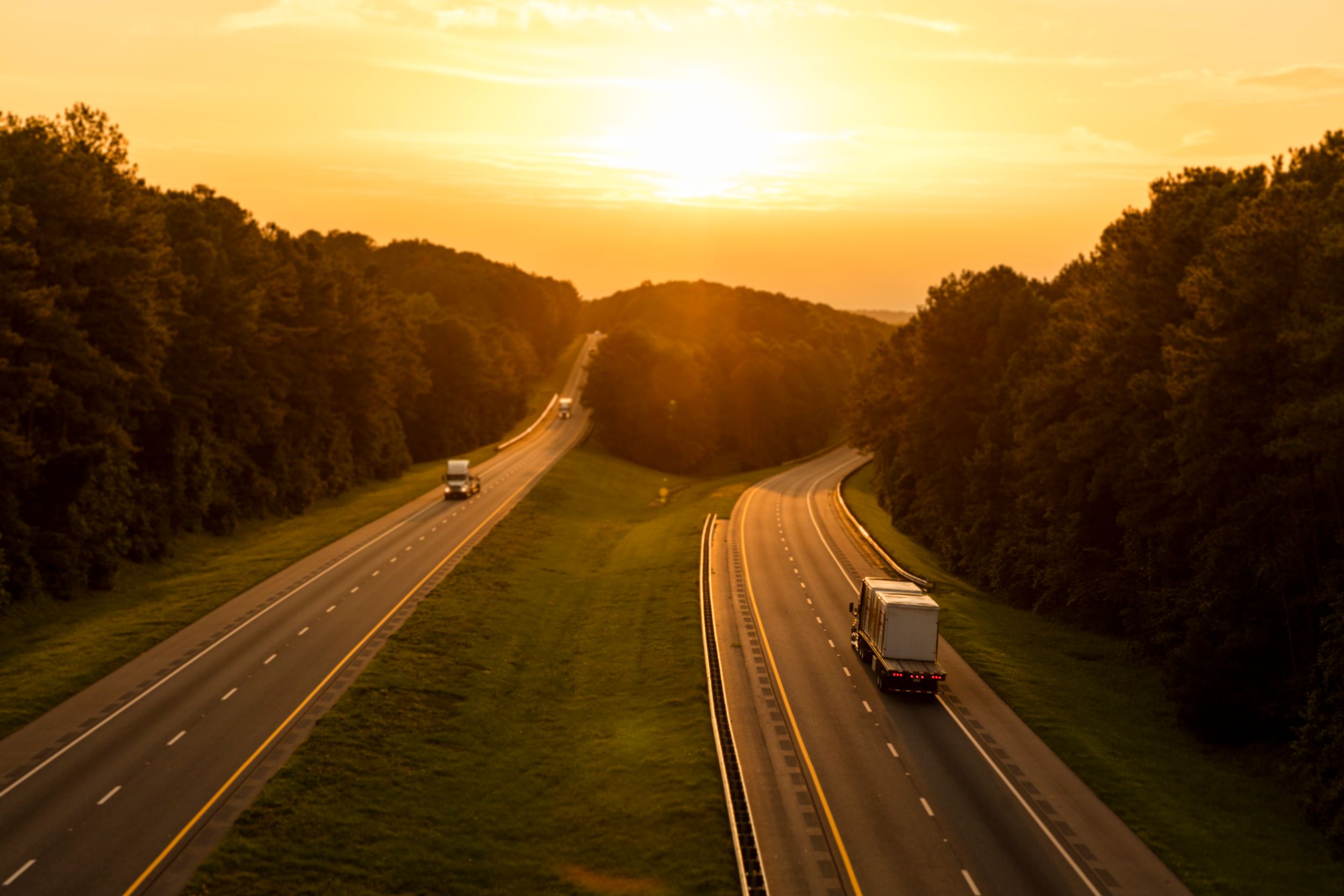 Sunset view of roadway with cars